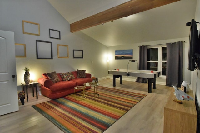 living room with high vaulted ceiling, light wood finished floors, baseboards, and beamed ceiling