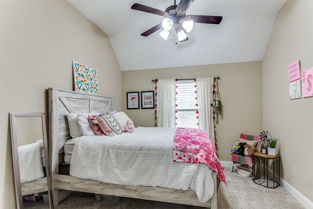 carpeted bedroom featuring vaulted ceiling, ceiling fan, and baseboards