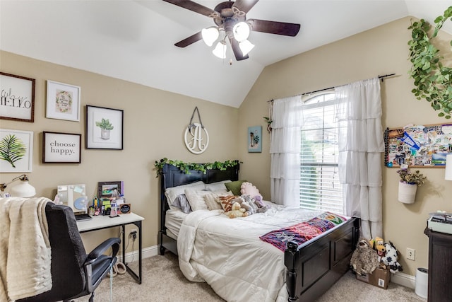 bedroom featuring lofted ceiling, ceiling fan, baseboards, and light colored carpet