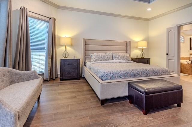 bedroom featuring recessed lighting, multiple windows, crown molding, and wood finished floors