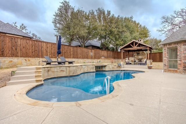 view of swimming pool with a fenced in pool, a patio area, a fenced backyard, and a gazebo