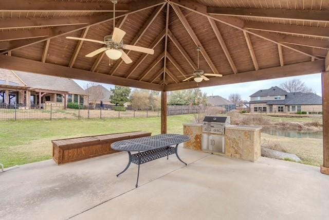 view of patio / terrace with area for grilling, fence, grilling area, and a gazebo