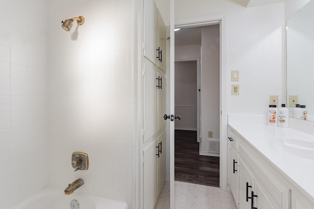 full bathroom featuring  shower combination, visible vents, and vanity