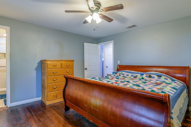 bedroom featuring visible vents, baseboards, a ceiling fan, dark wood-style floors, and ensuite bathroom