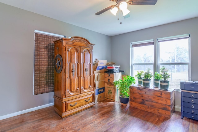 miscellaneous room featuring ceiling fan, wood finished floors, and baseboards