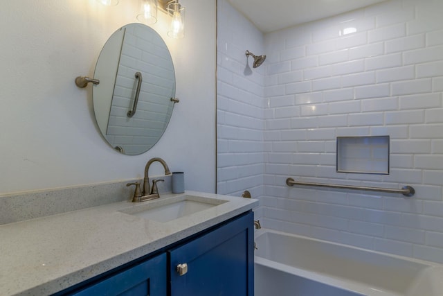 full bath featuring vanity and washtub / shower combination