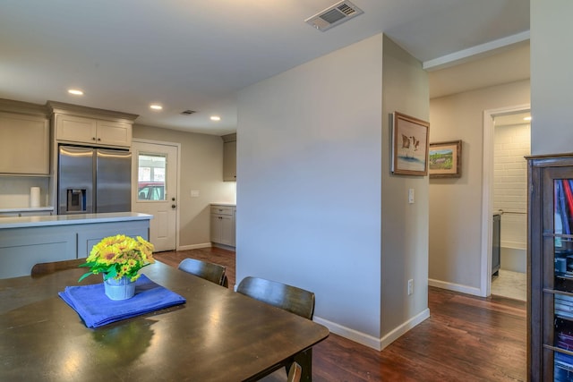 dining space featuring recessed lighting, dark wood finished floors, visible vents, and baseboards