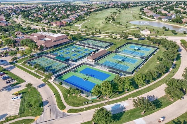 birds eye view of property with a water view and a residential view