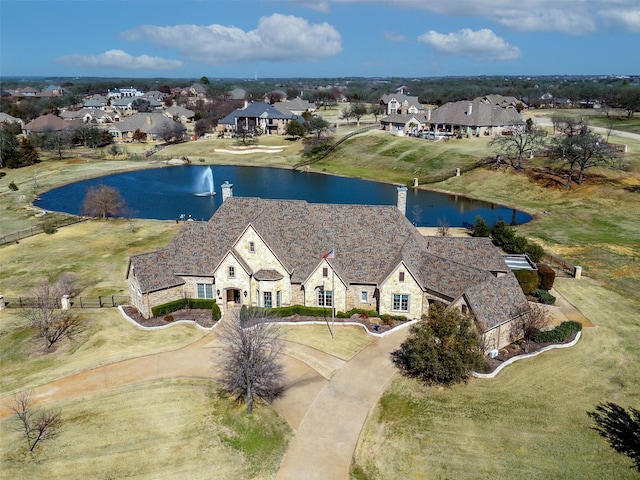 bird's eye view featuring a residential view and a water view