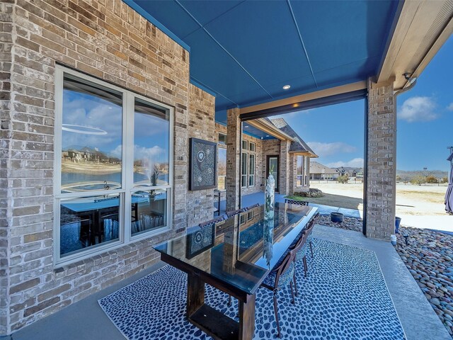 view of patio / terrace featuring a water view