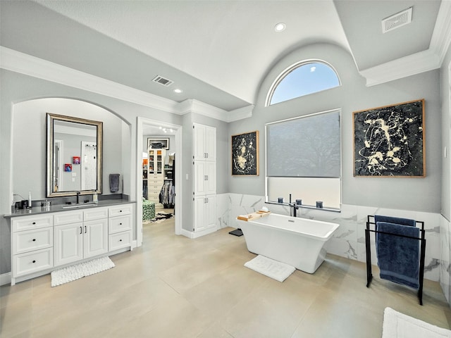 bathroom featuring vanity, visible vents, and crown molding