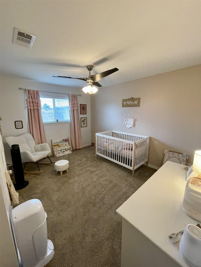 carpeted bedroom with visible vents and ceiling fan