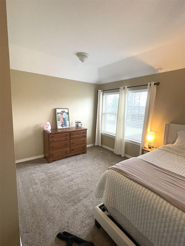 bedroom with carpet flooring and baseboards