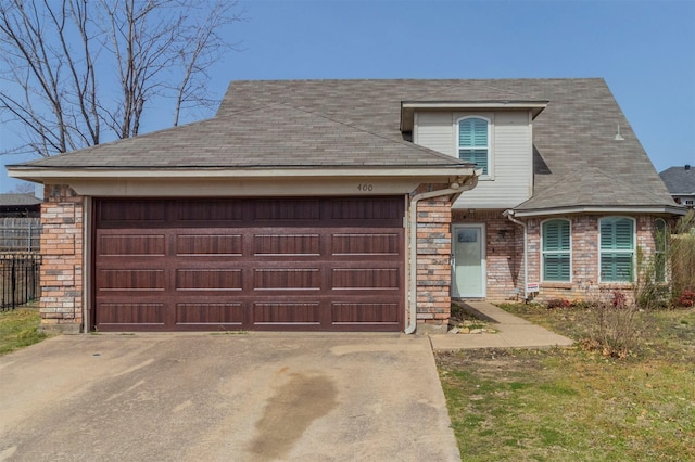 view of front of house featuring a garage, stone siding, and concrete driveway