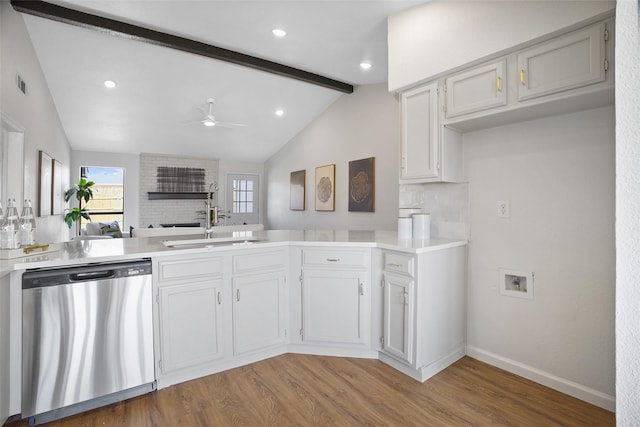 kitchen with vaulted ceiling with beams, visible vents, stainless steel dishwasher, light wood-style floors, and ceiling fan