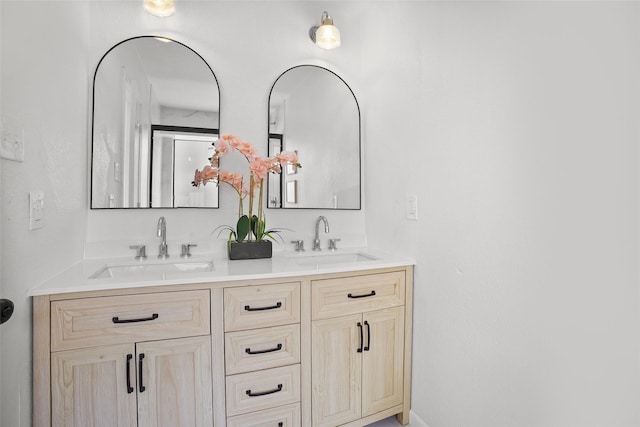 full bath with double vanity and a sink