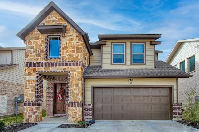 view of front of home with a garage, brick siding, concrete driveway, stone siding, and roof with shingles