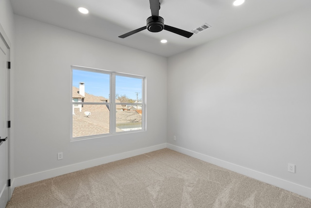 carpeted empty room featuring baseboards, visible vents, ceiling fan, and recessed lighting