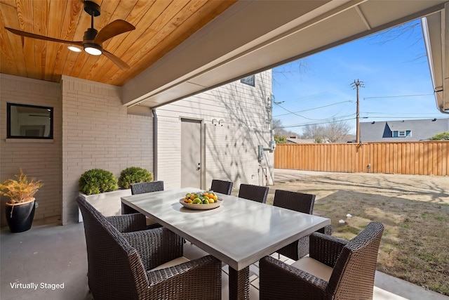 view of patio / terrace with outdoor dining area and fence