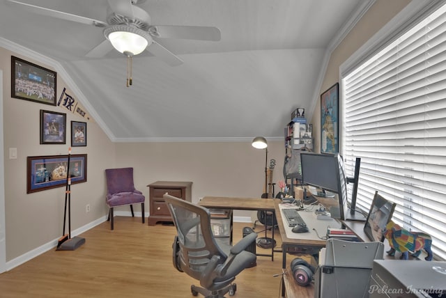 office area with crown molding, light wood-type flooring, vaulted ceiling, and baseboards