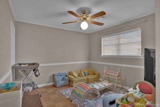 rec room featuring visible vents, crown molding, baseboards, and ceiling fan