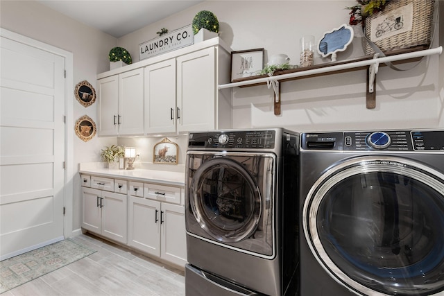 14402 Stice Rd, Krum, TX 76249 - laundry area featuring washing machine and clothes dryer and cabinet space