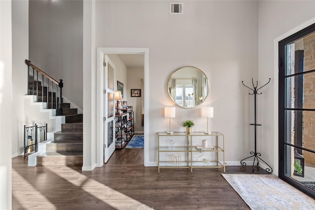 14402 Stice Rd, Krum, TX 76249 - entrance foyer with wood finished floors, stairway, a towering ceiling, and baseboards