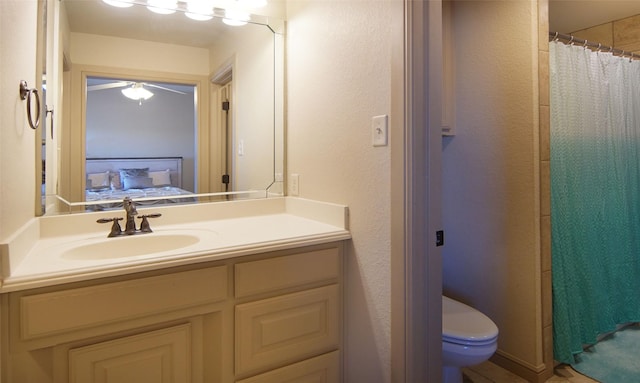 full bathroom featuring toilet, curtained shower, ensuite bathroom, and vanity