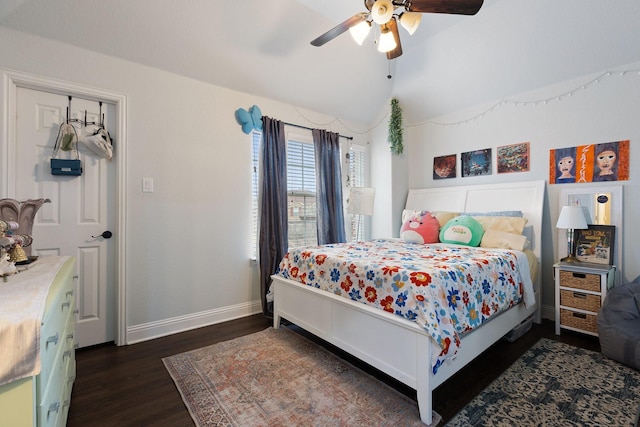 bedroom with vaulted ceiling, ceiling fan, wood finished floors, and baseboards