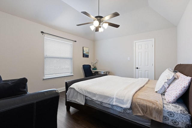 bedroom featuring ceiling fan, dark wood-style flooring, lofted ceiling, and baseboards