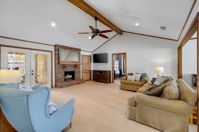 living room featuring a fireplace, visible vents, light wood-style floors, french doors, and beam ceiling