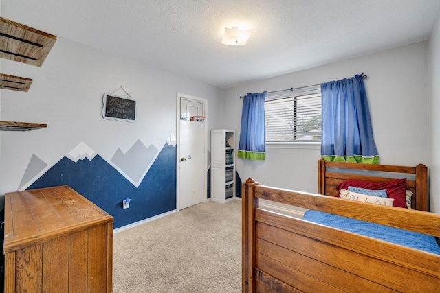 carpeted bedroom featuring a textured ceiling and baseboards