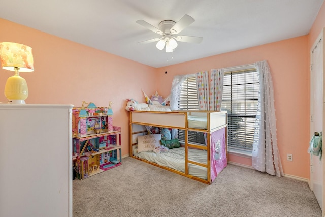 bedroom featuring carpet, baseboards, and a ceiling fan