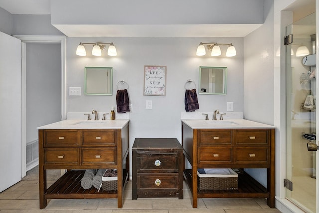 full bathroom with two vanities, a sink, and visible vents