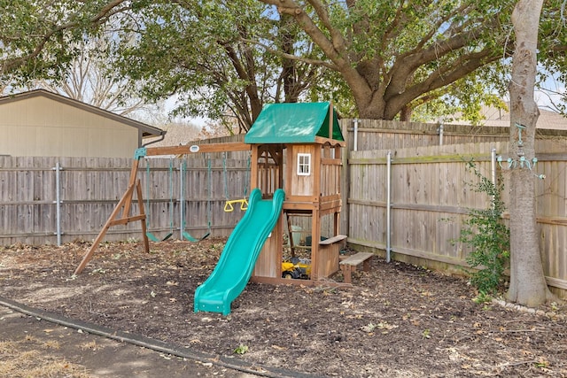 view of playground with a fenced backyard