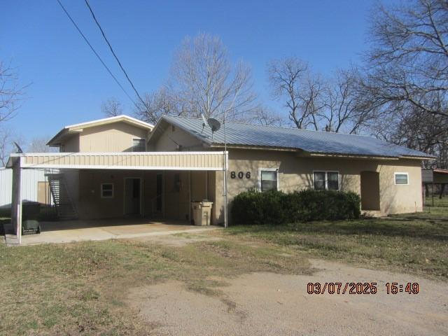 exterior space featuring metal roof