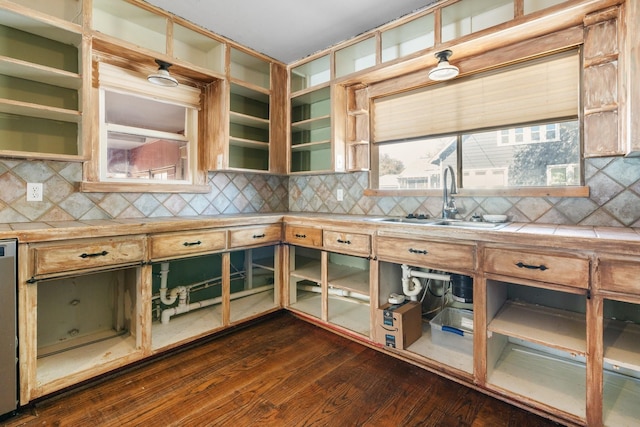 kitchen with tile countertops, tasteful backsplash, and a sink