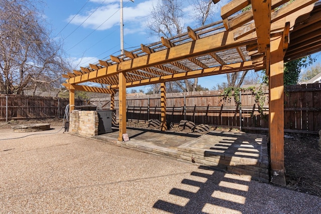 view of patio / terrace featuring a fenced backyard and a pergola