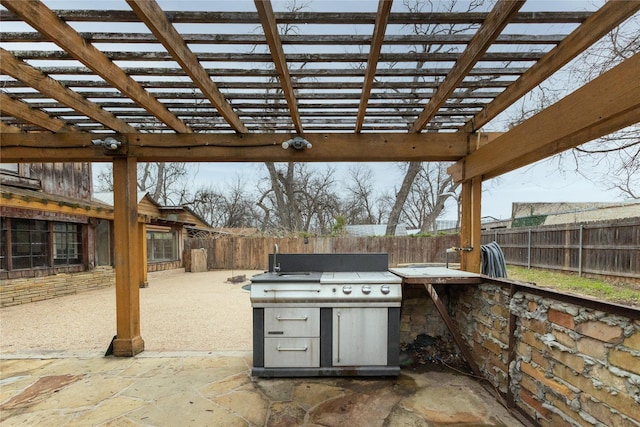 view of patio with a fenced backyard, area for grilling, and a pergola