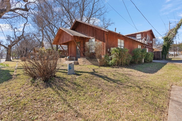 view of property exterior featuring a yard