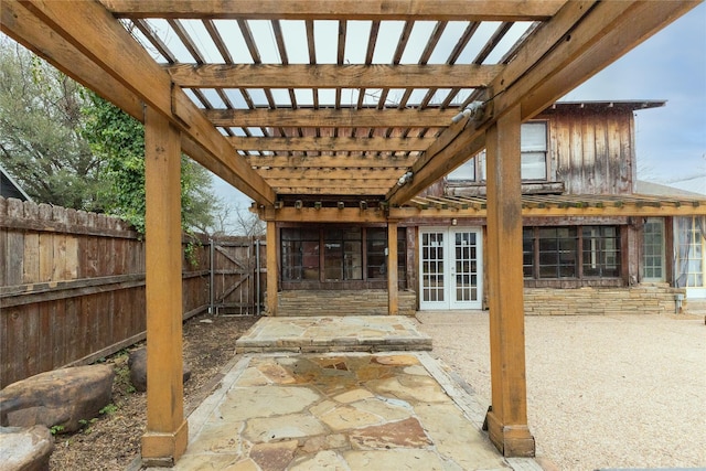 view of patio featuring a fenced backyard, a pergola, and french doors