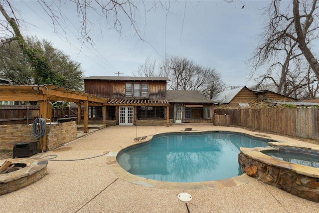 view of pool with an outdoor fire pit, a patio, a fenced backyard, french doors, and a pergola