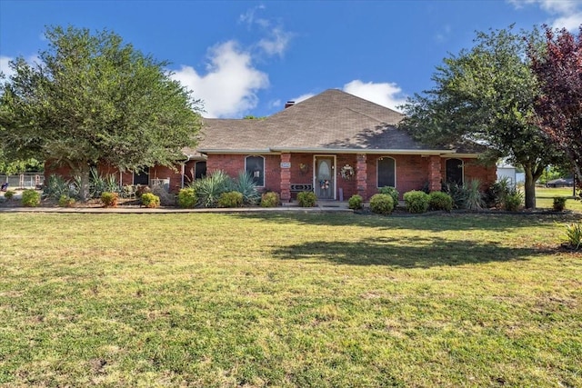 single story home featuring brick siding and a front yard