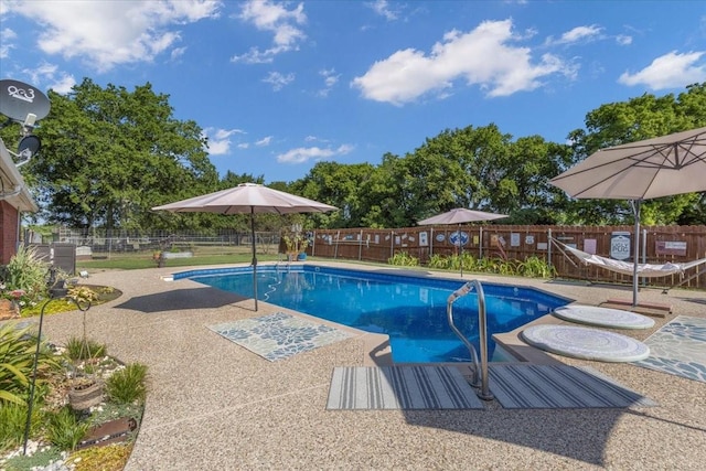 view of pool with a fenced backyard, a fenced in pool, and a patio