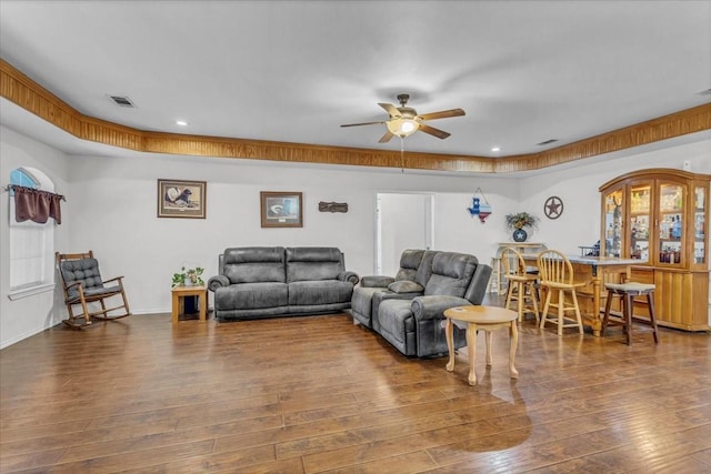 living area featuring recessed lighting, wood-type flooring, visible vents, a ceiling fan, and baseboards