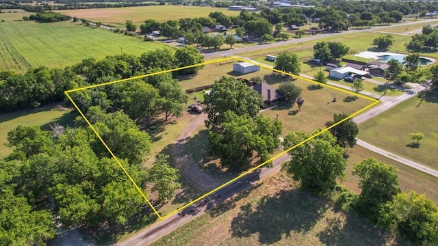 birds eye view of property with a rural view