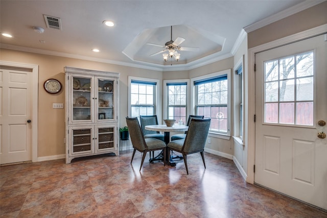 dining area featuring plenty of natural light, baseboards, visible vents, and ornamental molding