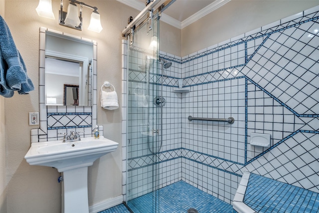 full bathroom with a sink, a shower stall, backsplash, and ornamental molding