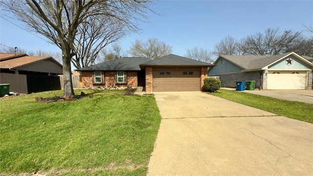 view of front of home featuring a front lawn, fence, concrete driveway, an attached garage, and brick siding