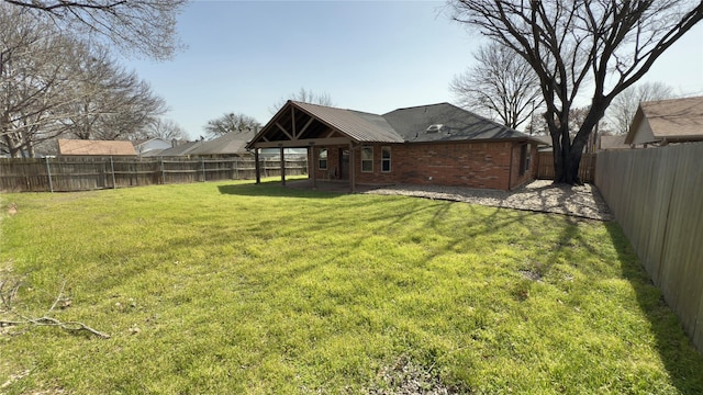 view of yard with a fenced backyard